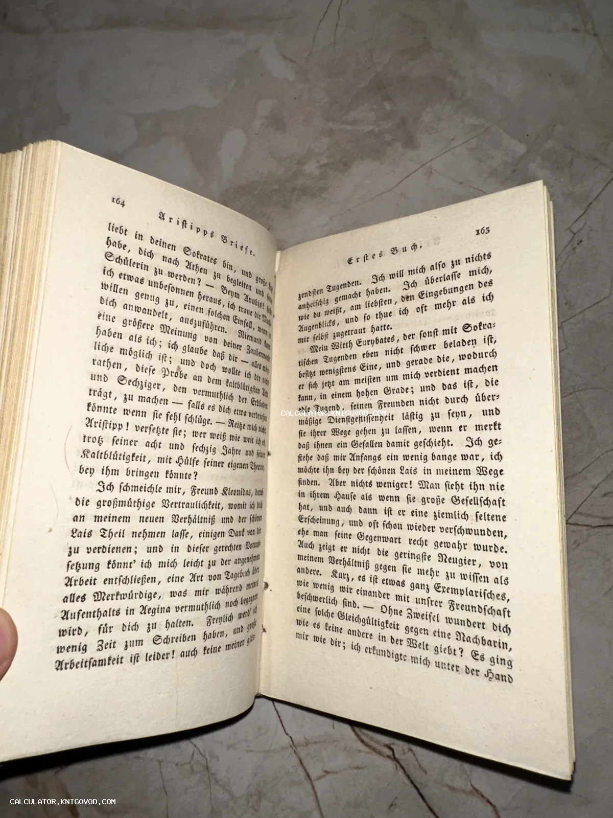 Разворот старинной книги с готическим шрифтом на немецком языке, страницы 164 и 165.