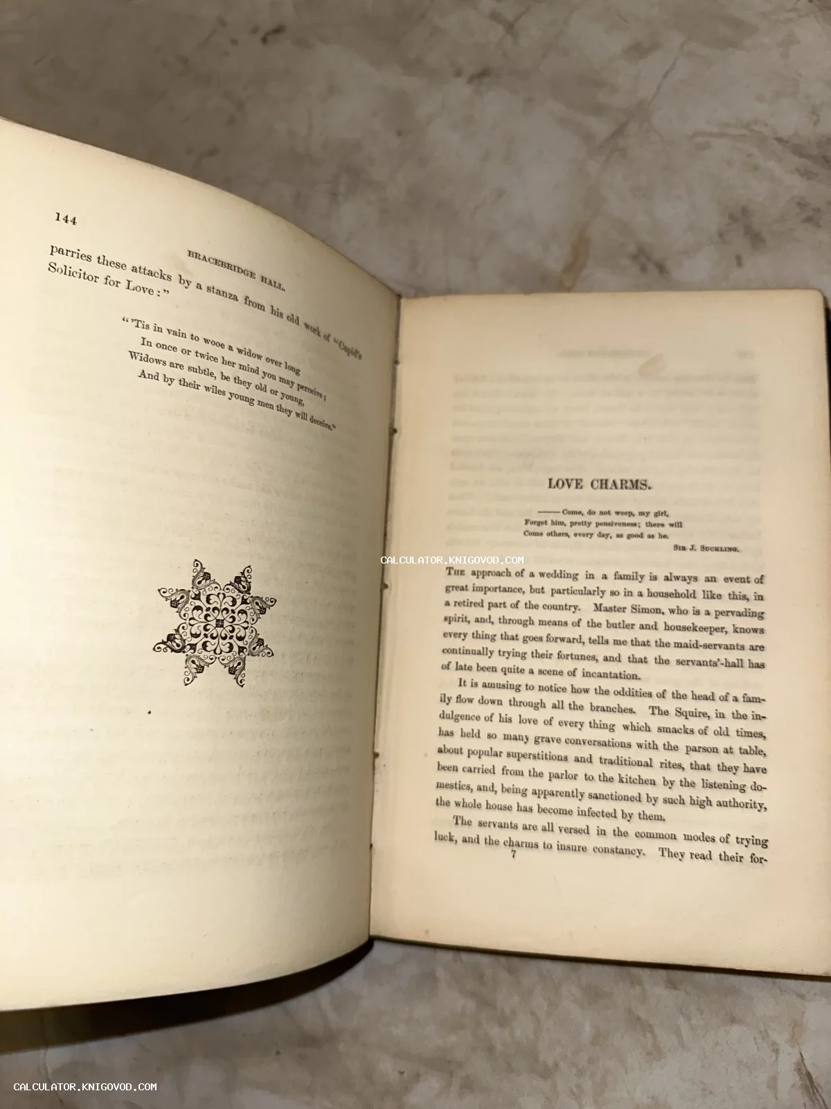 Разворот антикварной книги на английском языке с главой Love Charms и декоративной виньеткой.